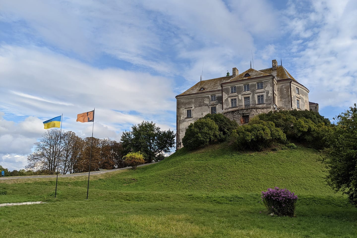 Olesko Castle on its hill above the surrounding farmland